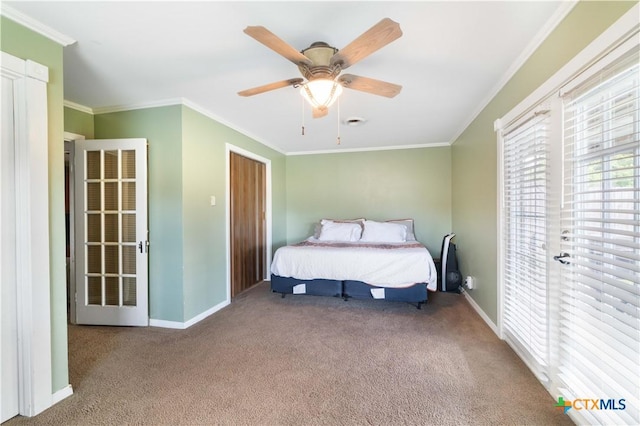 516 2nd St, Cuero, TX 77954 - carpeted bedroom with ornamental molding and a ceiling fan