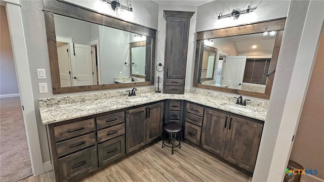 1026 County Road 3152, Kempner, TX 76539 - full bath featuring double vanity and wood finished floors