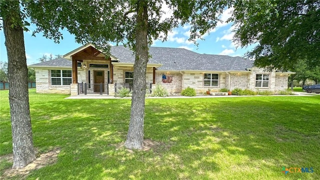 1026 County Road 3152, Kempner, TX 76539 - view of front facade featuring stone siding, a front yard, and roof with shingles