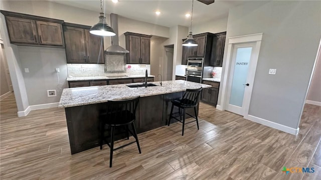 1026 County Road 3152, Kempner, TX 76539 - kitchen featuring a sink, decorative backsplash, baseboards, and recessed lighting