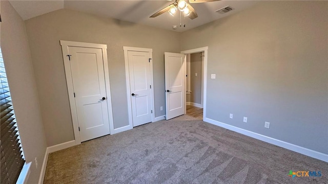 1026 County Road 3152, Kempner, TX 76539 - unfurnished bedroom with multiple closets, carpet floors, baseboards, and vaulted ceiling