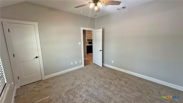1026 County Road 3152, Kempner, TX 76539 - unfurnished bedroom with baseboards, carpet floors, and a ceiling fan