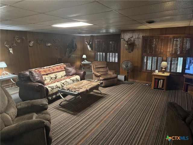 27 Wallace Ln, Victoria, TX 77904 - living room with carpet flooring, wooden walls, and a drop ceiling