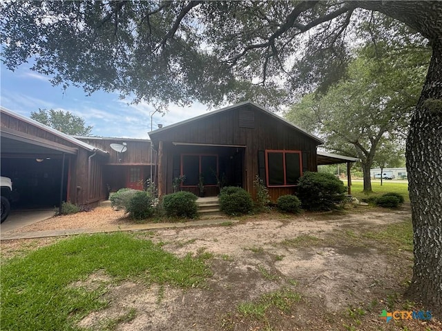 27 Wallace Ln, Victoria, TX 77904 - rear view of house with covered porch