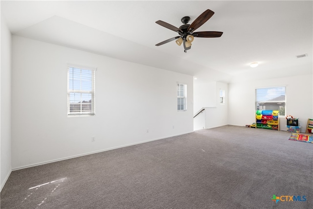 recreation room featuring carpet, a healthy amount of sunlight, and ceiling fan