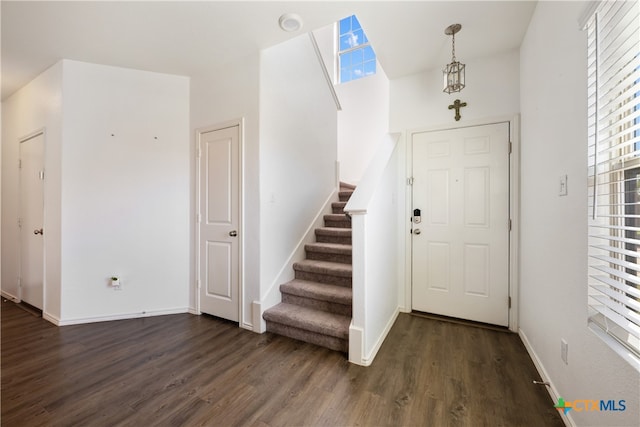 entryway with dark wood-type flooring