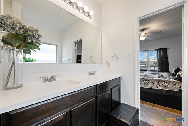 bathroom featuring ceiling fan and vanity