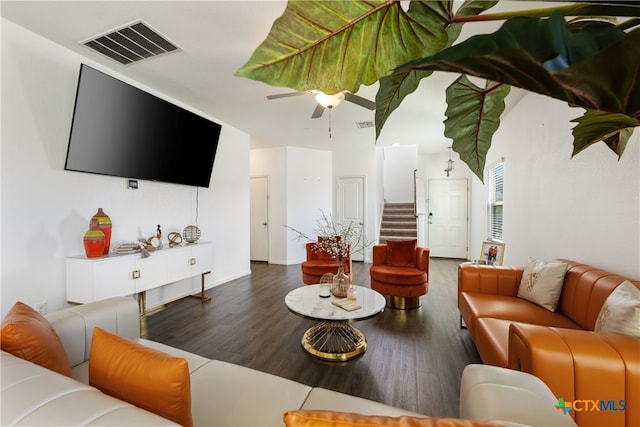 living room with hardwood / wood-style flooring and ceiling fan