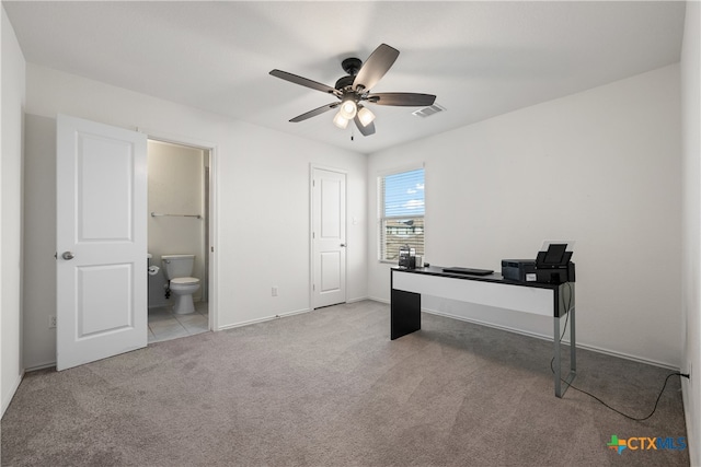 office space with ceiling fan and light colored carpet