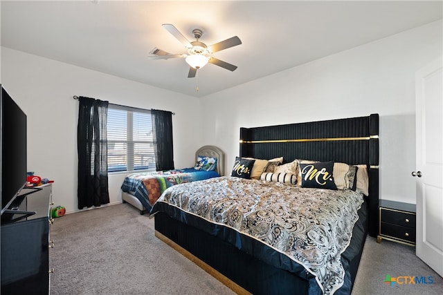 bedroom with ceiling fan and light colored carpet