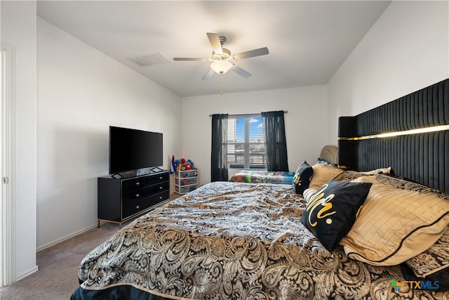 bedroom with ceiling fan and carpet floors