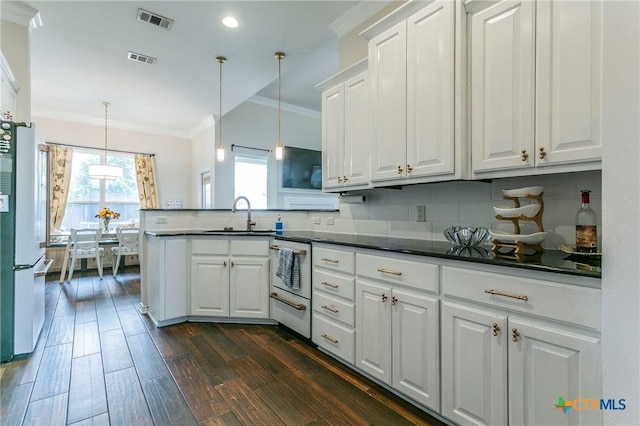 kitchen featuring dark wood-type flooring, sink, crown molding, pendant lighting, and white cabinetry