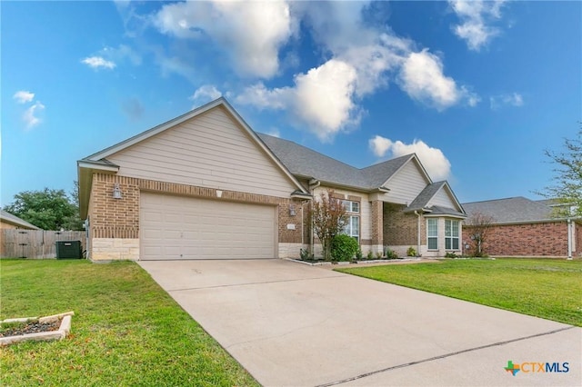 view of front facade with cooling unit, a garage, and a front lawn