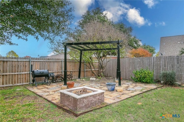 view of patio with a pergola, a fire pit, and a grill