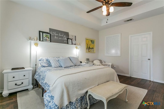 bedroom with ceiling fan and dark wood-type flooring