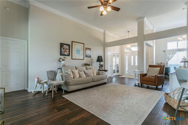 living room with crown molding and dark wood-type flooring