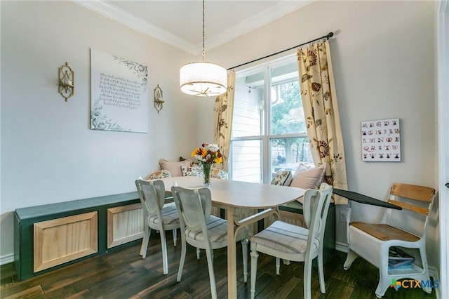 dining space with crown molding and dark hardwood / wood-style flooring