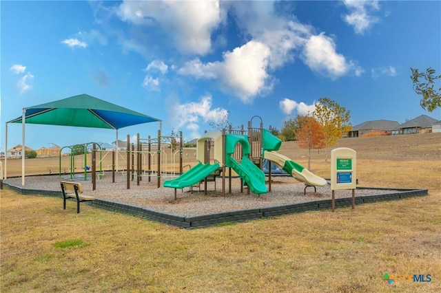 view of jungle gym with a lawn