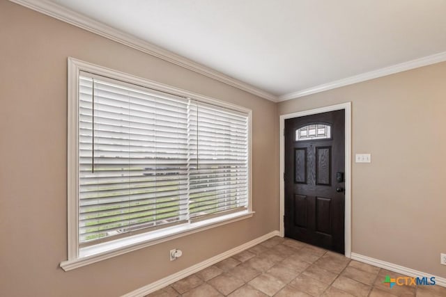 foyer featuring ornamental molding and light tile patterned flooring