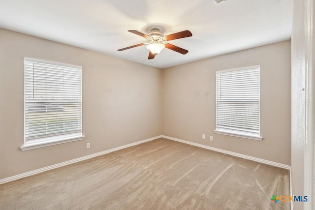 carpeted empty room with ceiling fan