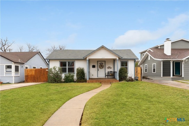 view of front of house with a porch and a front yard