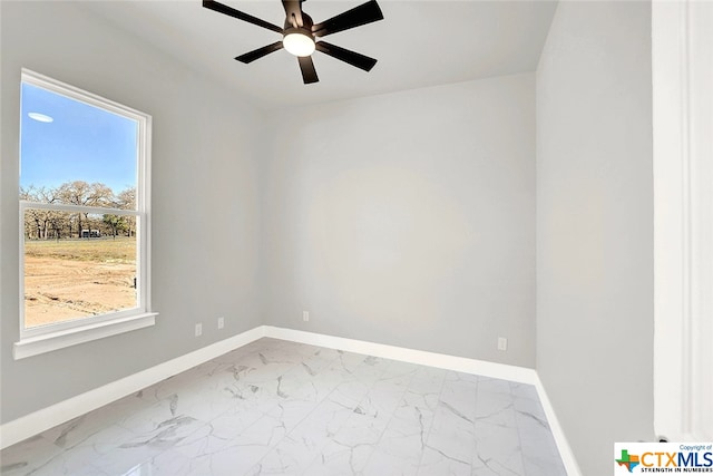 unfurnished room with a wealth of natural light and ceiling fan