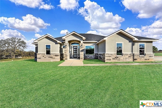 view of front of home featuring a front lawn