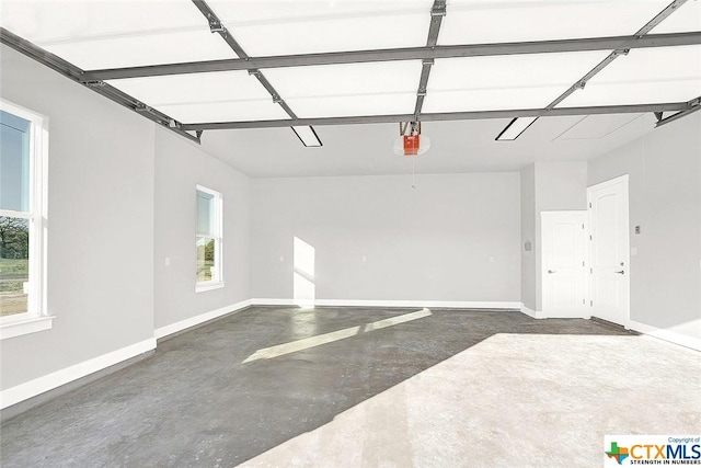 105 Hondo Rdg, La Vernia, TX 78121 - garage featuring a garage door opener and baseboards