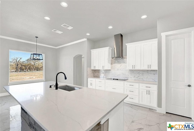 105 Hondo Rdg, La Vernia, TX 78121 - kitchen featuring wall chimney range hood, a sink, light marble finish floors, ornamental molding, and recessed lighting