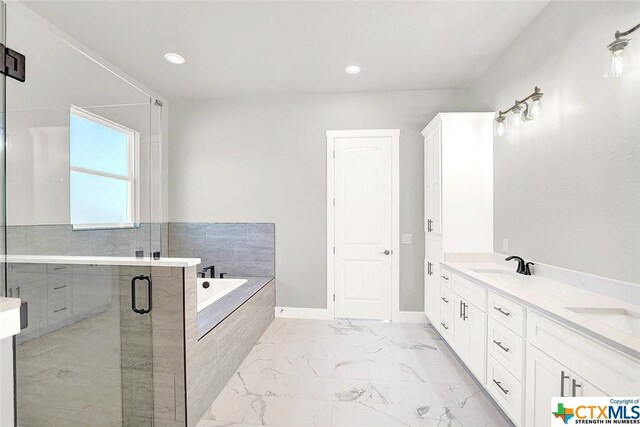 105 Hondo Rdg, La Vernia, TX 78121 - full bathroom featuring marble finish floors, a bath, a shower stall, double vanity, and recessed lighting