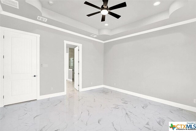 105 Hondo Rdg, La Vernia, TX 78121 - unfurnished bedroom with a tray ceiling, baseboards, marble finish floors, recessed lighting, and crown molding