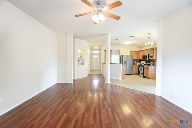 404 Chieftain Trl, Harker Heights, TX 76548 - unfurnished living room with baseboards, light wood-style flooring, ceiling fan, and lofted ceiling