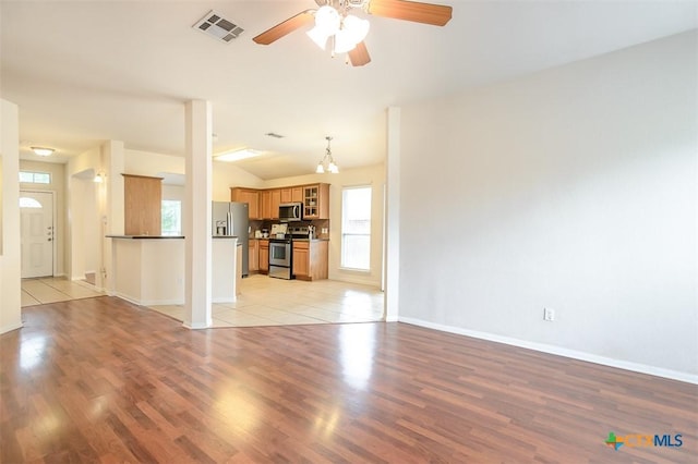 404 Chieftain Trl, Harker Heights, TX 76548 - unfurnished living room with baseboards, a ceiling fan, light wood finished floors, and visible vents