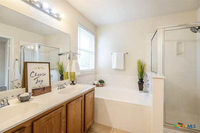 404 Chieftain Trl, Harker Heights, TX 76548 - bathroom featuring a garden tub, a sink, double vanity, and a shower stall