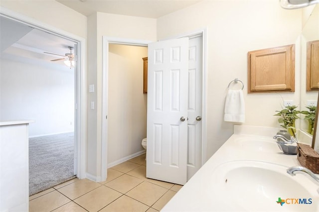 404 Chieftain Trl, Harker Heights, TX 76548 - bathroom with double vanity, a ceiling fan, toilet, tile patterned floors, and a sink
