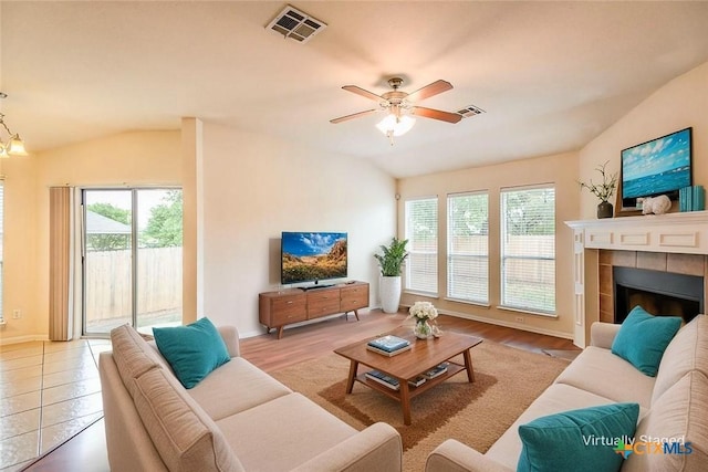 404 Chieftain Trl, Harker Heights, TX 76548 - living area with a ceiling fan, vaulted ceiling, a healthy amount of sunlight, and visible vents