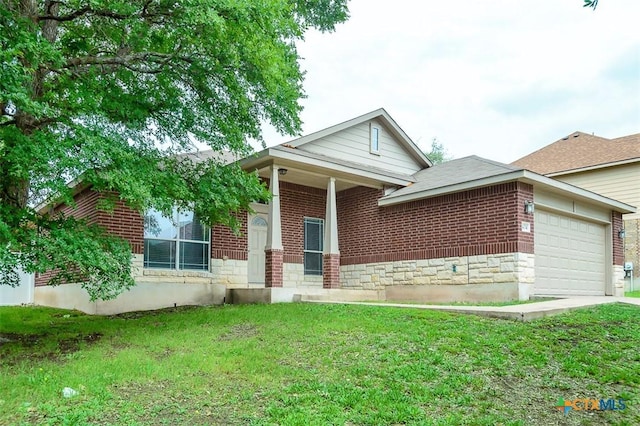 404 Chieftain Trl, Harker Heights, TX 76548 - ranch-style home featuring brick siding, an attached garage, stone siding, and a front yard
