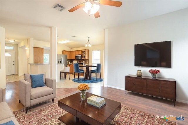 404 Chieftain Trl, Harker Heights, TX 76548 - living area featuring a ceiling fan, light wood-type flooring, lofted ceiling, and visible vents