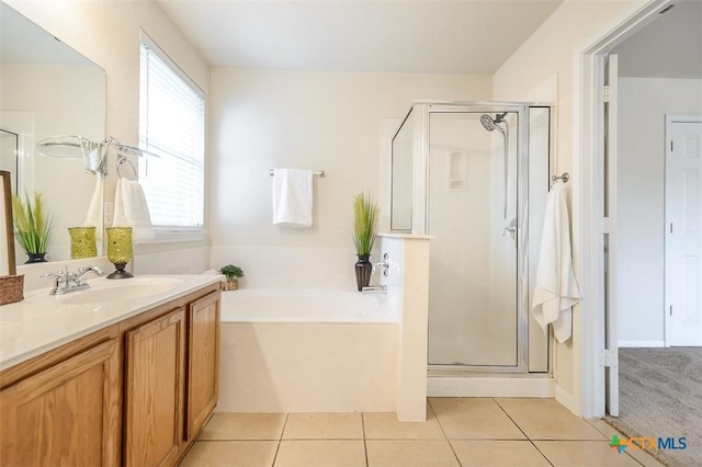 404 Chieftain Trl, Harker Heights, TX 76548 - full bathroom featuring tile patterned flooring, a sink, and a stall shower