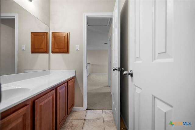 bathroom with tile patterned flooring and vanity