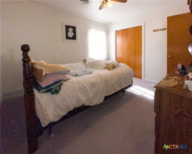 bedroom featuring carpet flooring, visible vents, and a ceiling fan