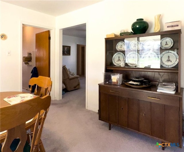 dining area with light colored carpet