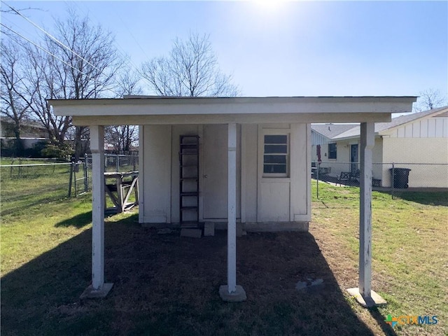 view of outbuilding with an outdoor structure and fence