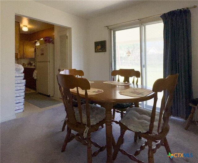 view of carpeted dining space