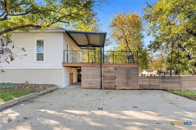 exterior space with ceiling fan and a wooden deck