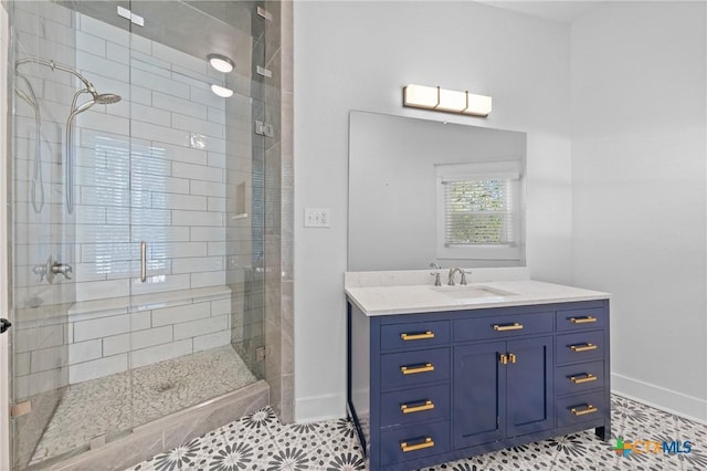 bathroom featuring tile patterned floors, vanity, and walk in shower