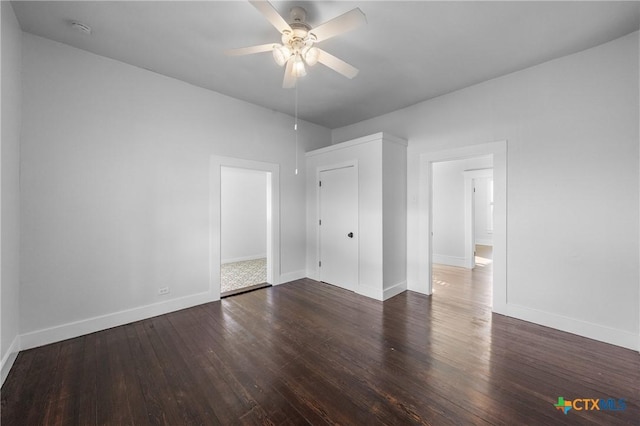 unfurnished room with ceiling fan and dark hardwood / wood-style flooring