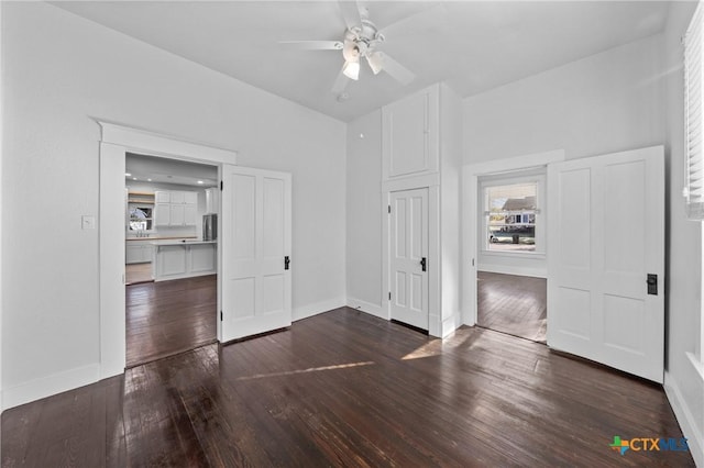 interior space featuring dark hardwood / wood-style flooring and ceiling fan