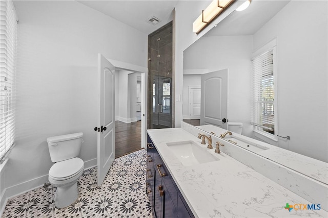 bathroom with vanity, wood-type flooring, and toilet