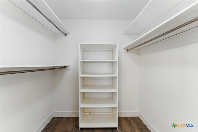 6022 Wildwind Dr, Windcrest, TX 78239 - walk in closet featuring dark wood-style floors
